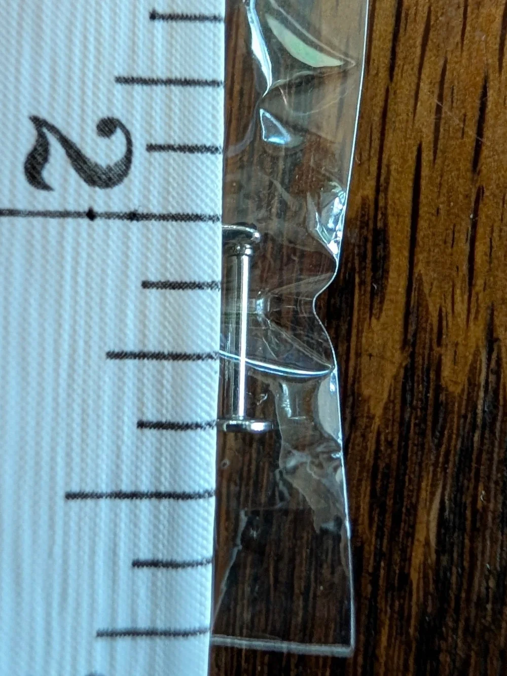 gothic skeleton hand labret stud piercing
